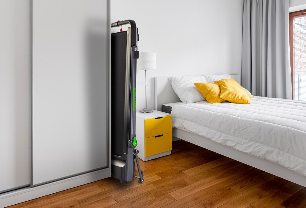 Bieżnia elektryczna TUNTURI Cardio Fit T10 1650W 12km-h mozliwosc zlozenia do wymiarow 76 x 16 x 155 cm wbudowane rolki transportowe przechowywanie w pionie w poziomie wydajna latwa w obsluga przemyslane rozwiazanie