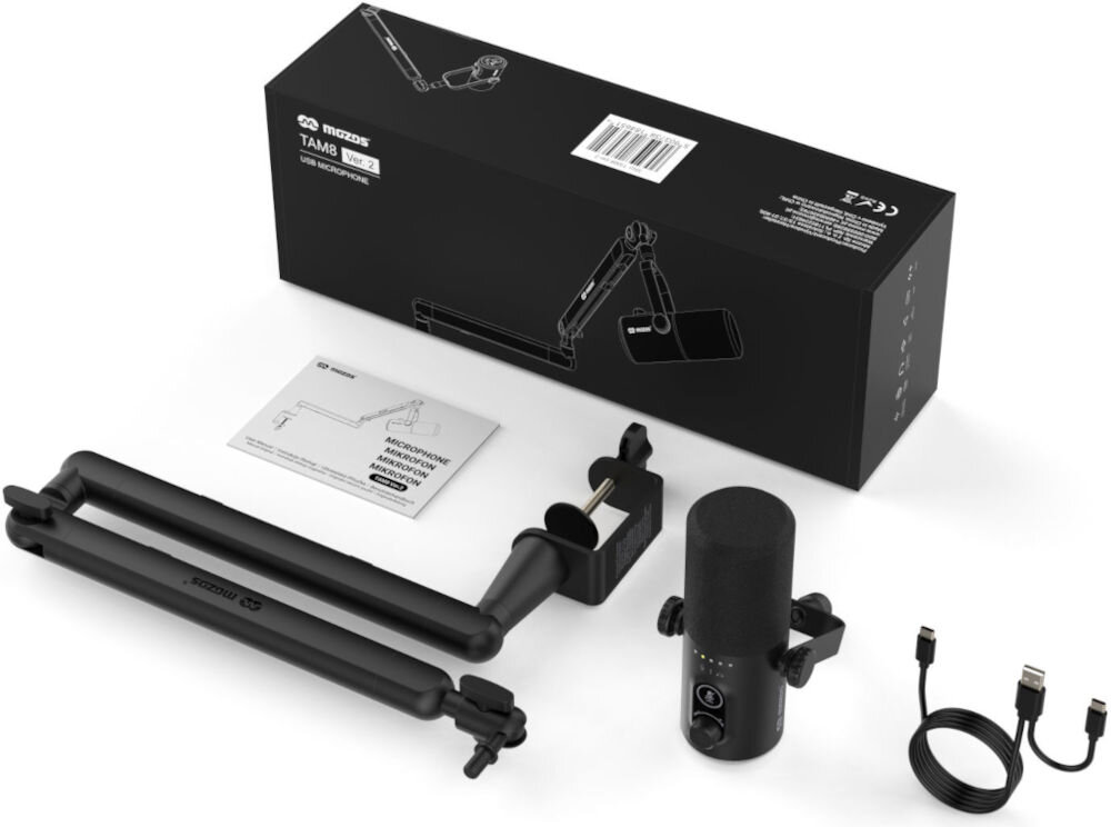 Mikrofon MOZOS TAM8 Kompletny zestaw Mozos TAM8 rozłożony na płasko: mikrofon z pianką, stalowe ramię z uchwytem biurkowym, instrukcja, dwa przewody USB, wszystko obok czarnego pudełka z grafiką produktu i instrukcją montażu