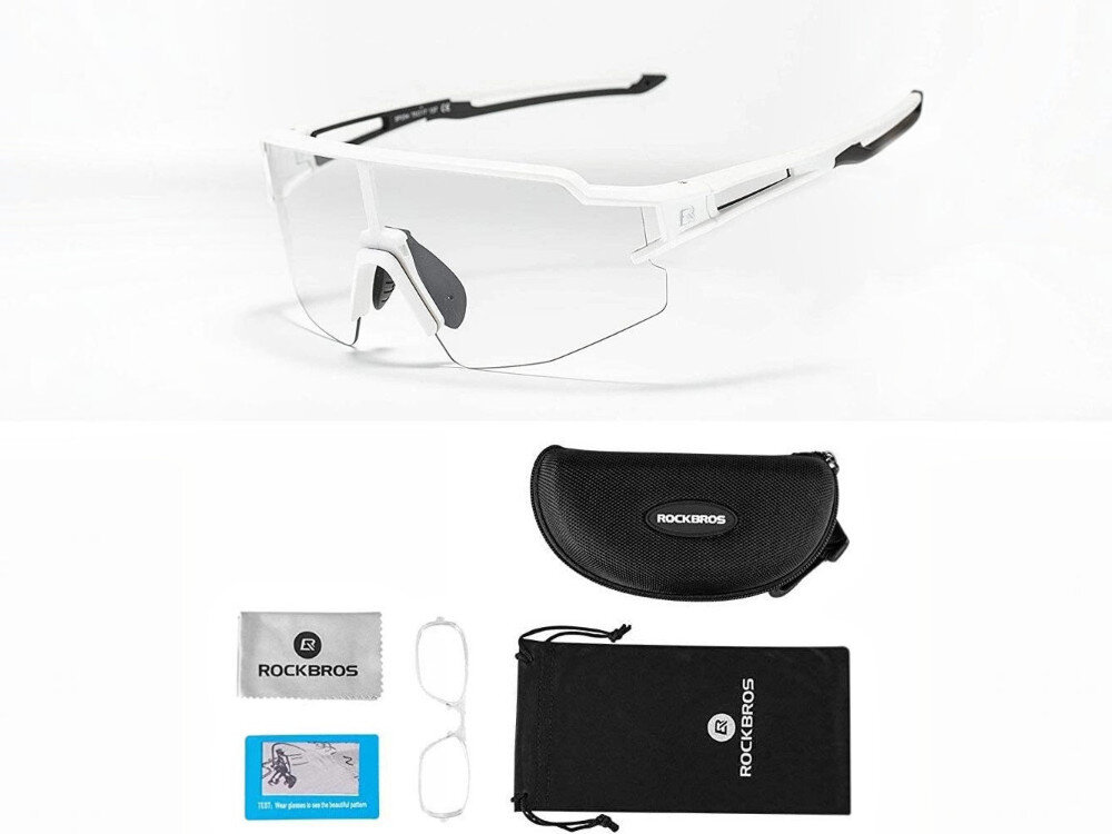 Na obrazie widoczne są białe okulary rowerowe z przezroczystymi soczewkami. Poniżej znajdują się etui z napisem \'ROCKBROS\', woreczek, ściereczka oraz dodatkowe akcesoria.