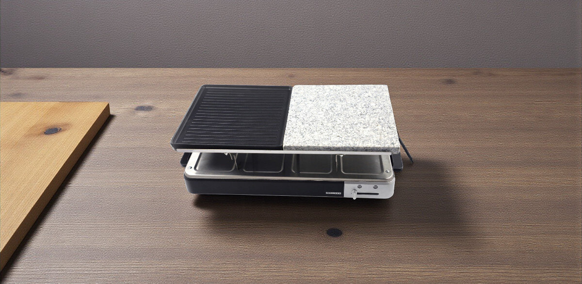 Grill elektryczny MELISSA 16300027, różnorodność, praktyczność, spotkania, okazje, Widok z góry na grill MELISSA 16300027 ustawiony na stole, rozdzielona powierzchnia grillowa: żeliwna oraz kamienna, w środku patelnie.