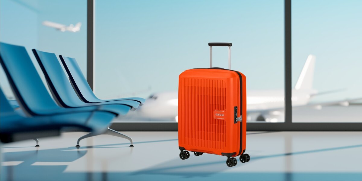 WALIZKA AMERICAN TOURISTER AEROSTEP SPINNER 55 20 BRIGHT ORANGE lifestyle lotnisko walizka okno Podróż zaczyna się tutaj trwałość ochrona wytrzymała konstrukcja polipropylen zamek TSA