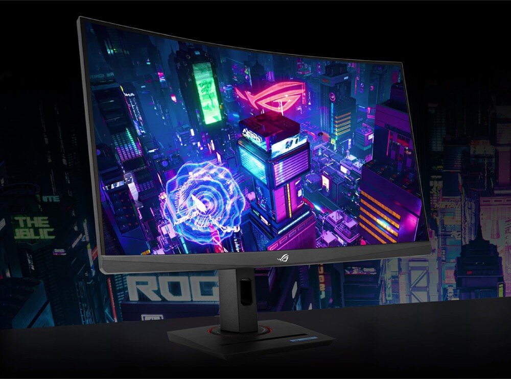 Monitor ASUS ROG Strix XG27WCMS Zakrzywiony monitor wyświetlający futurystyczną grafikę miasta z neonowymi światłami