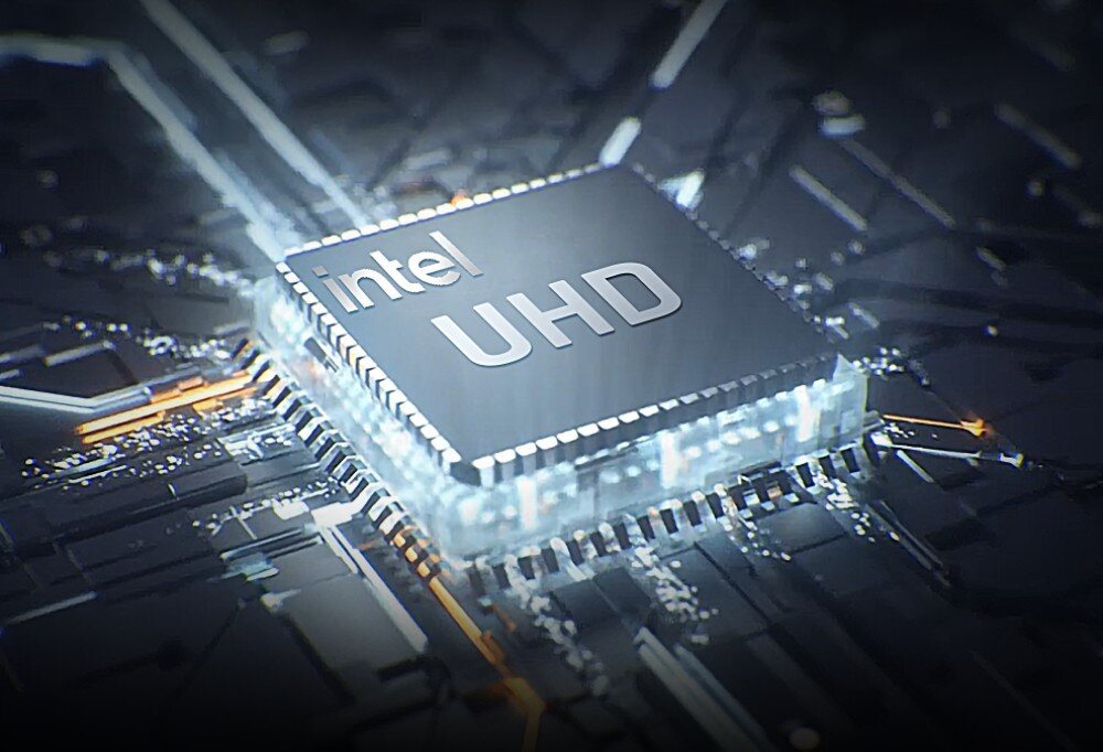 Komputer CHUWI CoreBox CWI601K2 Zbliżenie na układ Intel UHD na tle płyty głównej, z półprzezroczystą obudową chipu i delikatnymi poświatami, układ graficzny, obraz, rozdzielczość