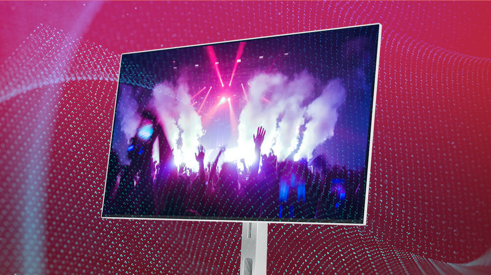 Monitor LENOVO L27h-4A 27 cali 2560x1440px IPS 100Hz 1 ms [MPRT] prezentacja monitora na czerwonym tle z poświatą świateł dwa głośniki moc 3 W Waves MaxxAudio® klarowny zrównoważony dźwięk