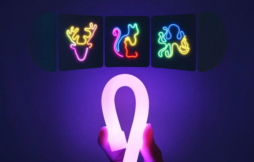 Taśma LED GOVEE Neon Rope Light 2 H61D5 5 m Wi-Fi/Bluetooth, elastyczne, diy, światło, oświetlenie, dłoń zgina taśmę LED, w tle na ścianie kształty zwierząt zrobione z taśmy LED