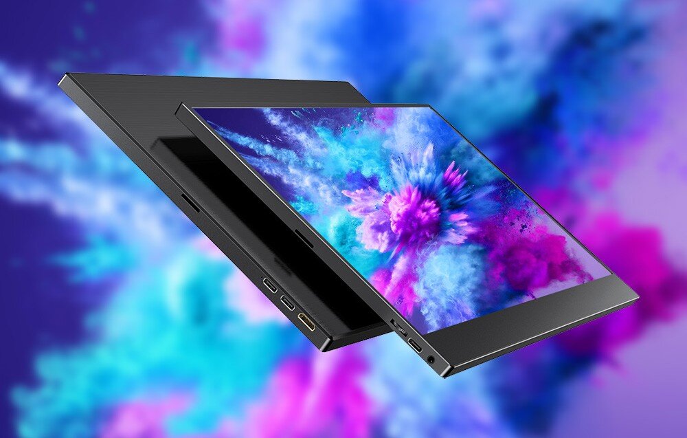 Monitor UPERFECT USetup E7 Dwa przenośne monitory ułożone pod kątem, wyświetlające kolorową grafikę w odcieniach niebieskiego i różu, z widocznymi portami z boku, głośniki, dźwięk, audio