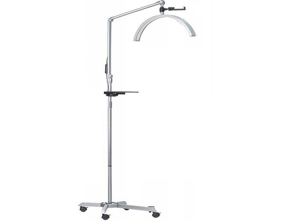 Lampa LED do paznokci MICHAEL MARINELLI GX530R Biały srebrna lampa stoi bokiem kółka uchwyt na telefon białe tło funkcjonalność estetyka aluminiowa konstrukcja stabilność trwałość matowe wykończenie z subtelnymi srebrnymi detalami elegancki wygląd salon kosmetyczny, gabinet lekarski studio tatuażu praktyczne narzędzie stylowy dodatek