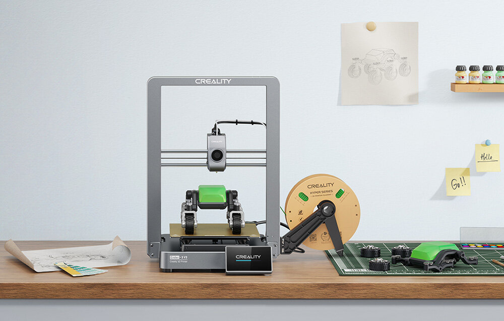 Creality Ender-3 V3 drukarka na blacie z zielonym filamentem