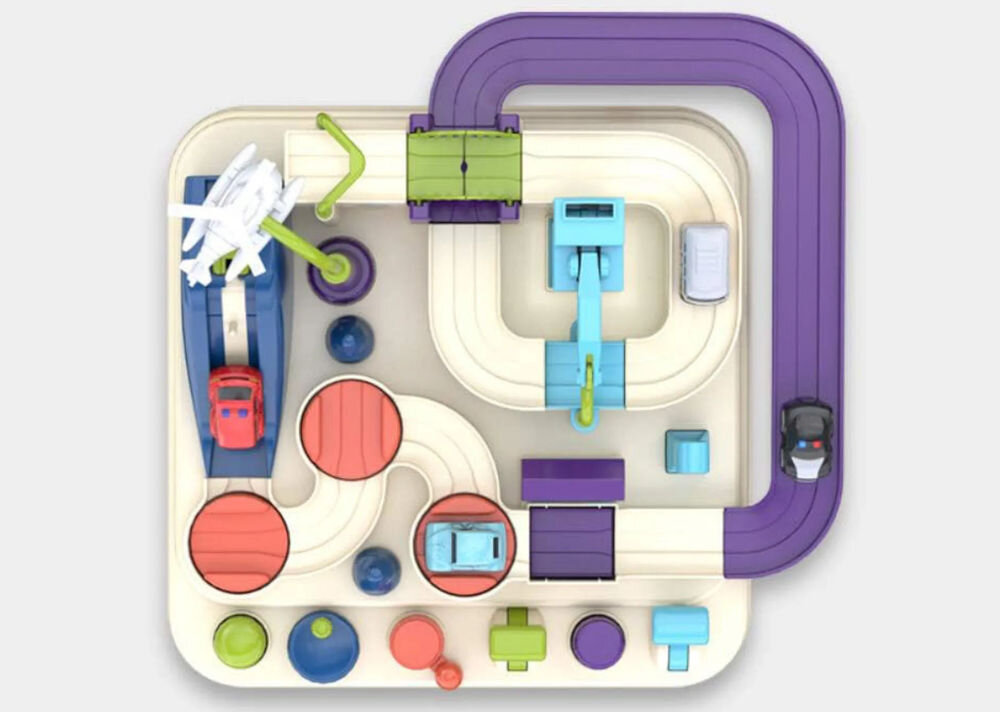 Tor samochodowy EXTRALINK Inteligentny EX.37605 prezentacja toru od góry na szarym tle interaktywny tor przeszkód wyzwanie dla młodego kierowcy sterowanie autkami przyciski gałki decydowanie o trasie rozwijanie twórczego myślenia