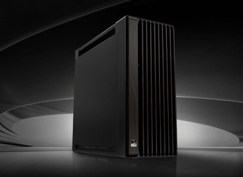 Obudowa ASUS ProArt PA602 Wood Edition Widok z dołu na ciemną obudowę komputera ustawioną w futurystycznej, oświetlonej przestrzeni, z frontowym panelem o pionowych żebrowaniach, opis