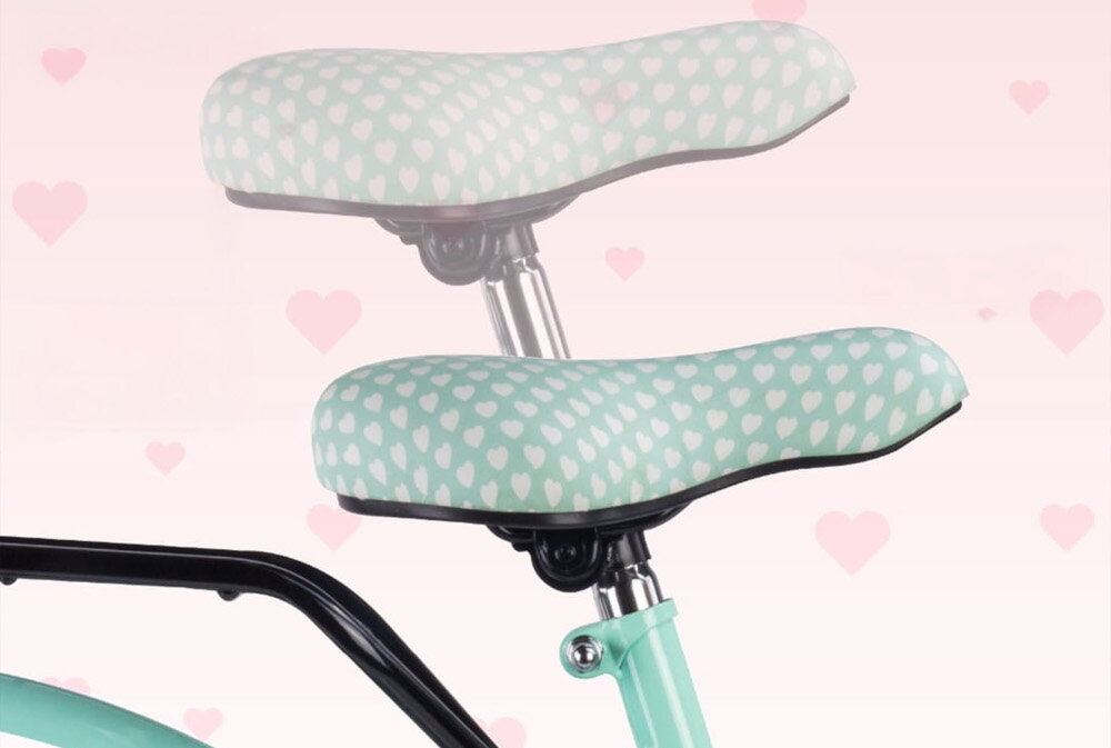 Rower młodzieżowy SUN BABY Heart Bike 24 cale dla dziewczynki Miętowy zbliżenie na siodełko wyszarzona możliwość regulacji zdjęcie na jasnym tle bezpieczna satysfakcjonująca aktywność wygodne siodełko regulacja w zakresie od 71 do 87 cm