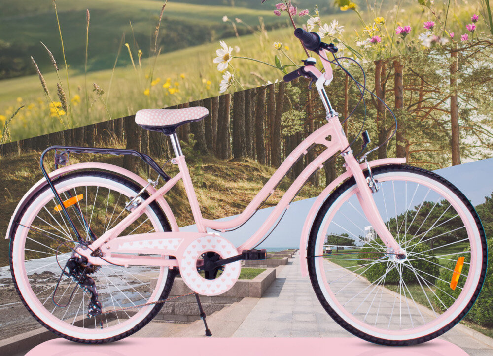 Rower młodzieżowy SUN BABY Heart Bike 24 cale dla dziewczynki Różowy rower widoczny z boku w tle łąka i kwiaty dla dzieci w wieku od 8 do 12 lat trwałość wytrzymałość mocna konstrukcja