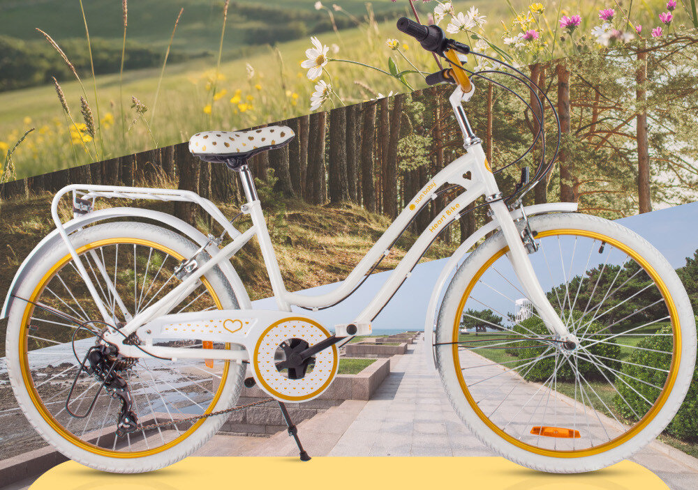 Rower młodzieżowy SUN BABY Heart Bike 24 cale dla dziewczynki Biało-złoty rower widoczny z boku w tle łąka i kwiaty dla dzieci w wieku od 8 do 12 lat trwałość wytrzymałość mocna konstrukcja