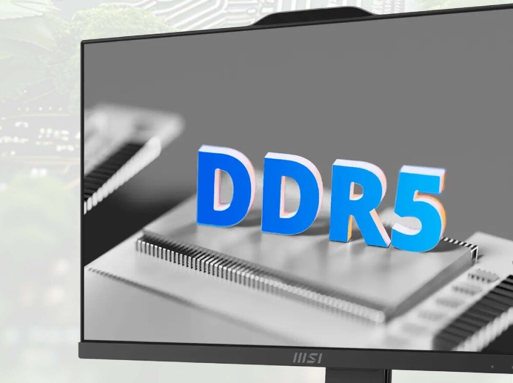 Komputer MSI Pro AP242P 14M-859EU Zbliżenie ekranu monitora z napisem 'DDR5' w trójwymiarowych literach na tle układu scalonego, pamięć dysk pojemność szybkość