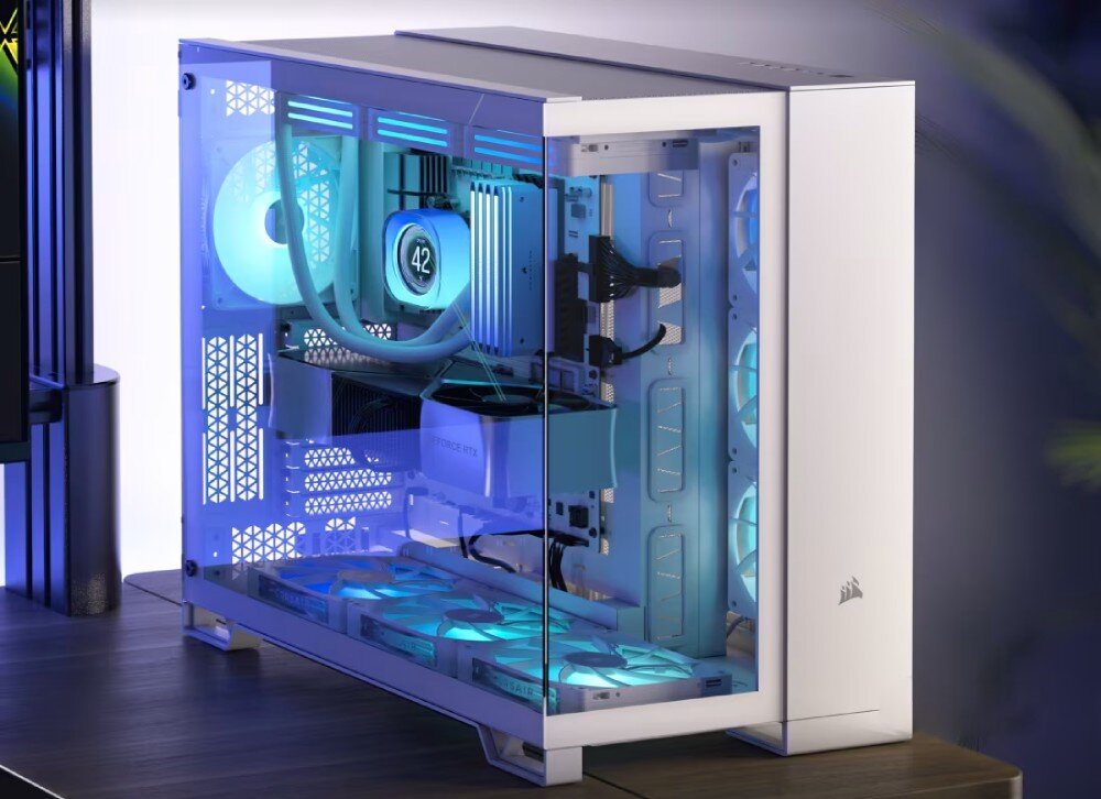 Obudowa CORSAIR 6500X Biały RGB Biała obudowa komputerowa z dwiema komorami i przeszklonym frontem oraz bokiem, prezentująca wnętrze z tęczowo podświetlonymi wentylatorami i chłodzeniem wodnym