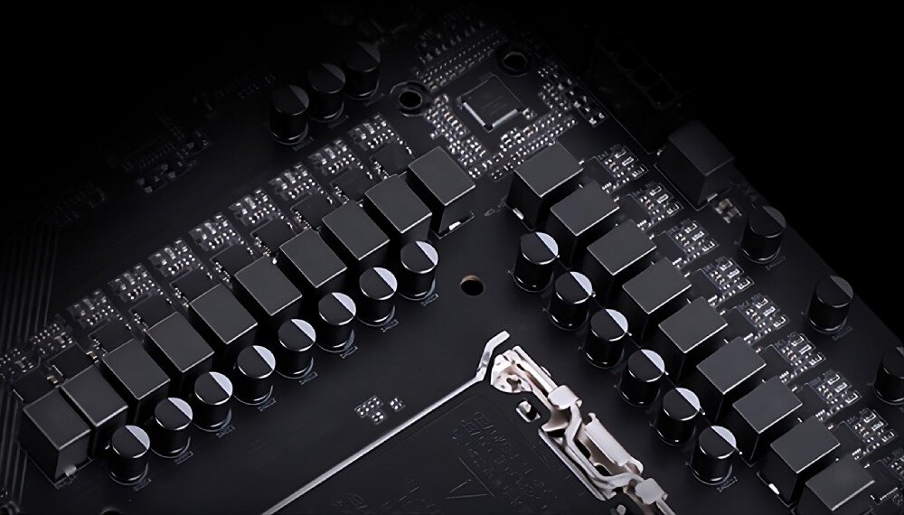 Płyta główna GIGABYTE X870 Eagle WiFi7 Sekcja zasilania procesora składająca się z rzędów sześciennych dławików i kondensatorów na czarnym laminacie, układ zasilania, stabilność