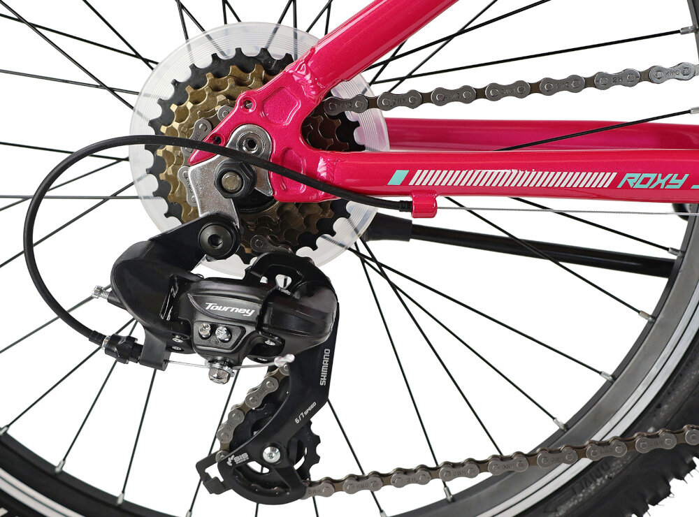 Rower młodzieżowy INDIANA Roxy Jr 24 cale dla dziewczynki Różowo-miętowy zbliżenie na przerzutki 18 przełożeń przednia i tylna przerzutka SHIMANO Tourney do rekreacyjnej jazdy na rowerze duża wytrzymałość sprawne działanie zmiana biegów jest płynna i bezproblemowa manetki SAIGUAN SG-52 Revo 6x3 odpowiednie dobranie właściwego przełożenia do danego terenu