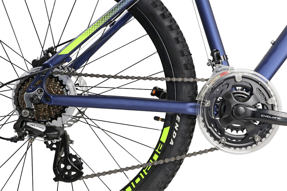 Rower górski MTB INDIANA X-Pulser 2.6 M19 26 cali męski Czarno-zielony zbliżenie na korbę wolnobieg i łańcuch lekka wydajna konstrukcja korby korba CYCLONE typu 24/34/42 wolnobieg SHIMANO typu MF-TZ500-7 14x28 7V solidność wytrzyma bardzo duży nacisk na pedały