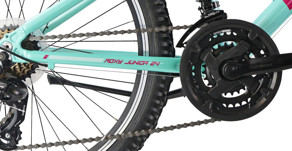 Rower młodzieżowy INDIANA Roxy Jr 24 cale dla dziewczynki Miętowo-różowy zbliżenie na korbę i wolnobieg lekka i wydajna konstrukcja korby AMAR typu 24/34/42x150 Onyx wolnobieg SPARK typu 14-28T 6V solidny i wytrzyma obciążenie nawet w trudnych warunkach