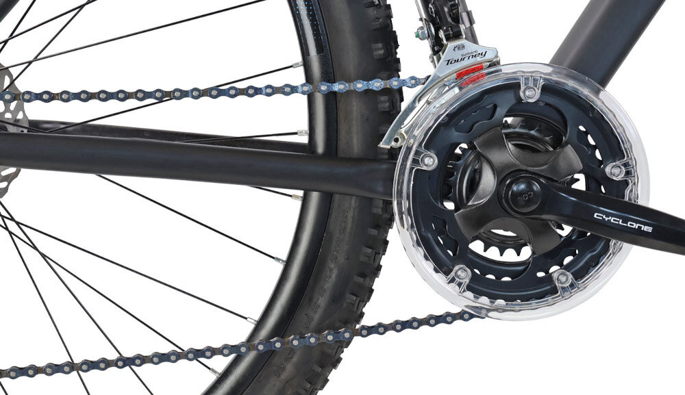 Rower górski MTB INDIANA X-Pulser 1.9 M23 29 cali męski Czarno-niebieski zbliżenie na korbę wolnobieg i łańcuch lekka wydajna konstrukcja korby korba CYCLONE typu 24/34/42T wolnobieg SHIMANO typu MF-TZ500 14-28 7 Speed solidność wytrzyma bardzo duży nacisk na pedały