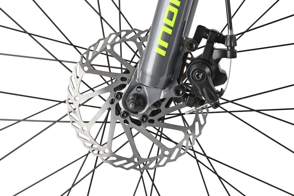 Rower młodzieżowy INDIANA Rock Jr 24 cale dla chłopca Limonkowo-szary zbliżenie na przedni hamulec podstawa bezpieczeństwa przedni hamulec tarczowy mechaniczny w każdych warunkach pogodowych i na każdej trasie bardzo duża siła hamowania tylny hamulec typu V-Brake lekki duża siła hamowania