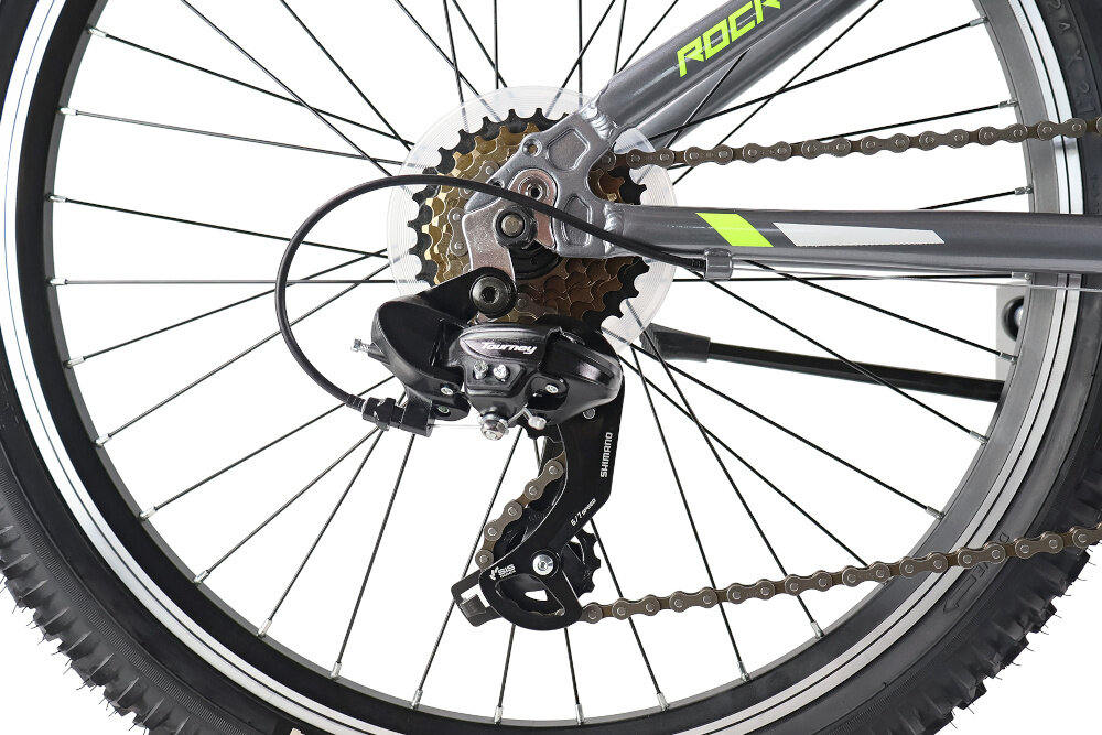 Rower młodzieżowy INDIANA Rock Jr 24 cale dla chłopca Szaro-limonkowy zbliżenie na przerzutki 18 przełożeń przednia i tylna przerzutka SHIMANO Tourney do rekreacyjnej jazdy na rowerze duża wytrzymałość sprawne działanie zmiana biegów jest płynna i bezproblemowa manetki SAIGUAN SG-52 Revoshift 6x3 odpowiednie dobranie właściwego przełożenia do danego terenu