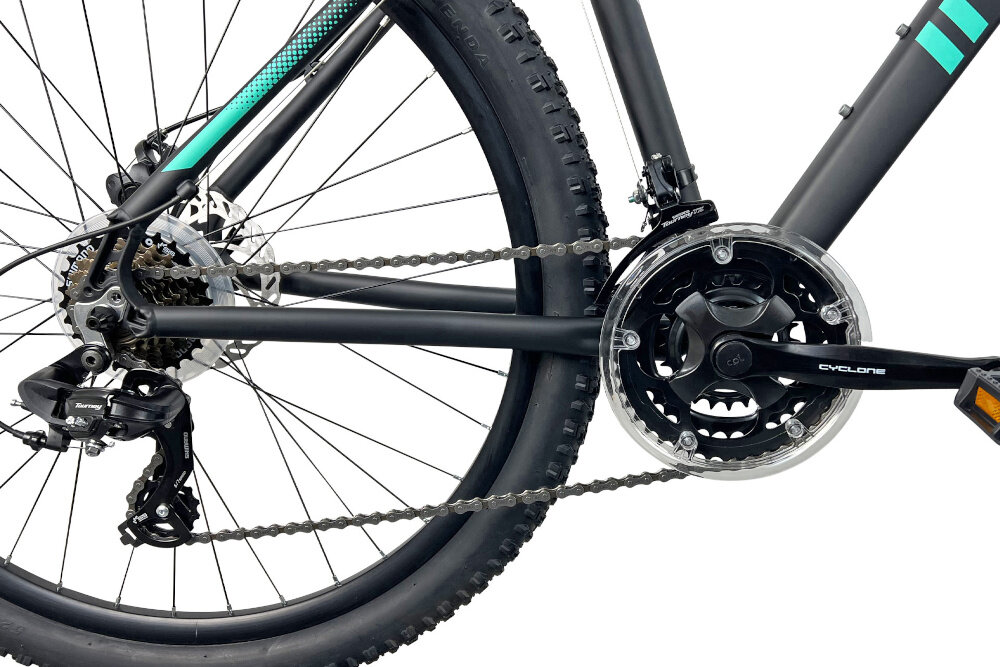 Rower górski MTB INDIANA X-Pulser 2.7 D19 27.5 cala damski Czarno-miętowy zbliżenie na korbę wolnobieg i łańcuch lekka wydajna konstrukcja korby korba CYCLONE typu CTL3 24/34/42 x 170 mm wolnobieg SHIMANO typu TZ-500 14-34 7 Speed solidność wytrzyma bardzo duży nacisk na pedały