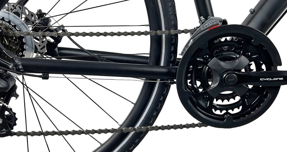 Rower crossowy INDIANA X-Cross 2.0 D15 damski Czarno-różowy zbliżenie na korbę wolnobieg i łańcuch lekka wydajna konstrukcja korby korba SCYCLONE typu CTL3 28/38/48-170 wolnobieg SHIMANO typu MF-TZ500-7 14x28 7V solidność wytrzyma bardzo duży nacisk na pedały