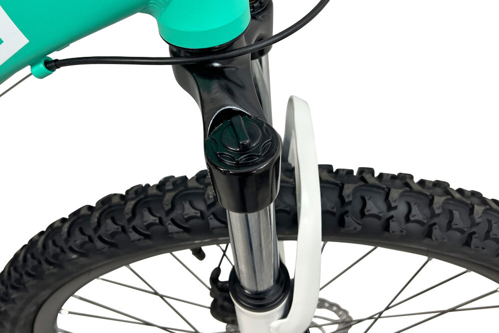 Rower górski MTB INDIANA X-Pulser 2.6 D15 26 cali damski Miętowo-biały zbliżenie na amortyzator rower typu hardtail przedni amortyzator marki HL Corp typ HL-389 26 Ahead ułatwia najeżdżanie na przeszkody niweluje wstrząsy niska masa roweru duża sztywność regulacja za pomocą sprężyny obsługa poprzez manetki