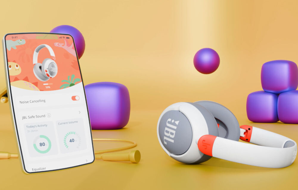 Słuchawki nauszne JBL Junior 470NC ANC aplikacja uruchomiona na smartfonie obok słuchawki kontrola rodzicielska zabezpieczenie PIM ograniczenie do 81 dB