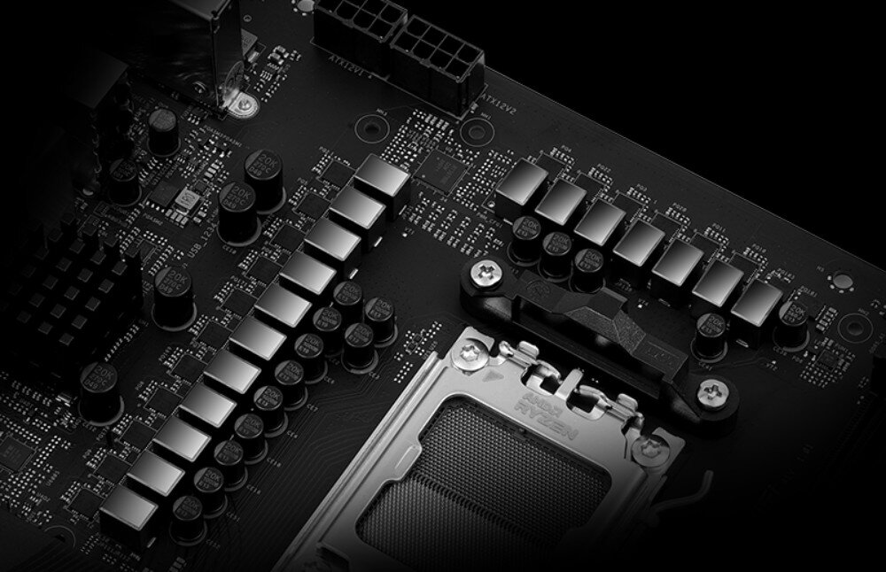 Płyta główna ASROCK X870 Riptide WiFi Fragment płyty głównej z widocznymi sekcjami zasilania VRM i kondensatorami obok gniazda procesora, układ zasilania, kondensatory, stabilność, płyta PCB