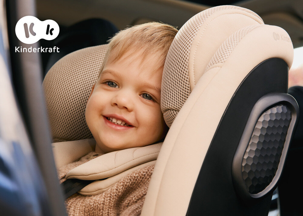 Fotelik samochodowy KINDERKRAFT Xpedition 3 I-Size 40-150 cm (0-22 kg) Beżowy wnętrze samochodu dziecko siedzi w foteliku zbliżenie na zagłówek system bezpieczeństwa H-GUARD SYSTEM wielowarstwowy zagłówek z dodatkową pianką memory absorbuje energię uderzenia maluch będzie bezpieczny dla dzieci o wzroście od 40 do 150 cm