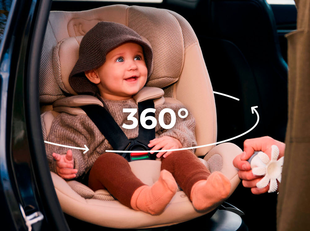 Fotelik samochodowy KINDERKRAFT Xpedition 3 I-Size 40-150 cm (0-22 kg) Czarny wnętrze samochodu dziecko siedzi w foteliku strzałka pokazująca możliwość obrotu system EASY SPIN SYSTEM 360° zmiana kierunku montażu wygodne wkładanie i wyjmowanie malucha z fotelika jeden prosty ruch pozwala obrócić fotelik