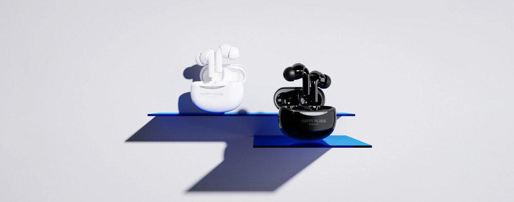 Słuchawki dokanałowe HAPPY PLUGS Joy Pro - Komfort i dźwięk, słuchawki z etui ładującym stojące na półkach