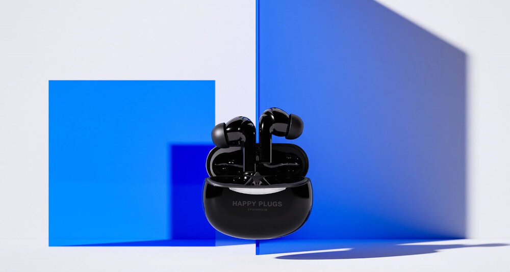 Słuchawki dokanałowe HAPPY PLUGS Joy Pro - Czysty dźwięk każdego dnia, słuchawki z etui ładującym na niebiesko-białym tle