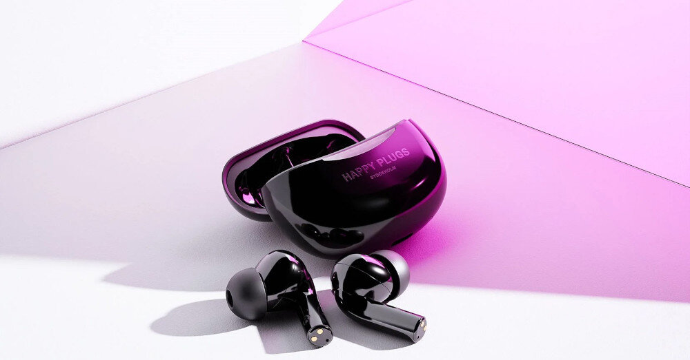 Słuchawki dokanałowe HAPPY PLUGS Joy Pro - Aktywna cisza wokół Ciebie, słuchawki z etui ładującym na białym blacie