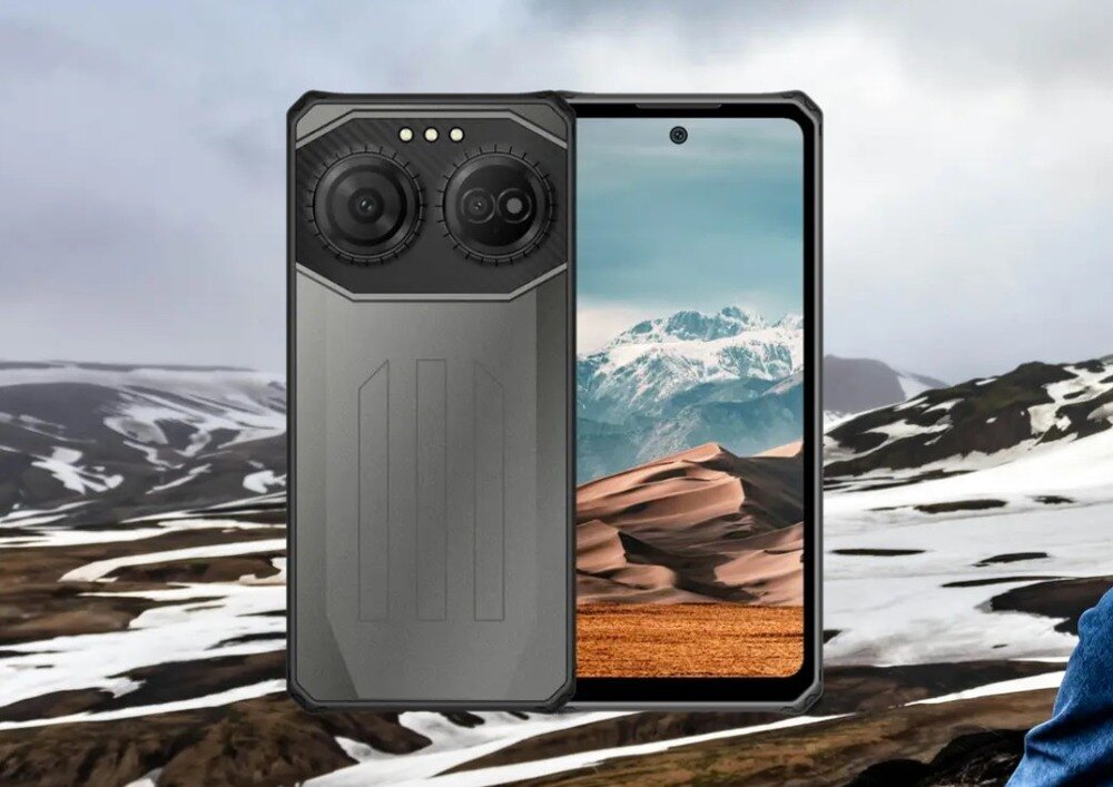 Na obrazie widoczny jest smartfon z dużym ekranem, na którym wyświetlany jest krajobraz górski. Obok ekranu widać tylną część urządzenia z dwoma dużymi obiektywami aparatu.