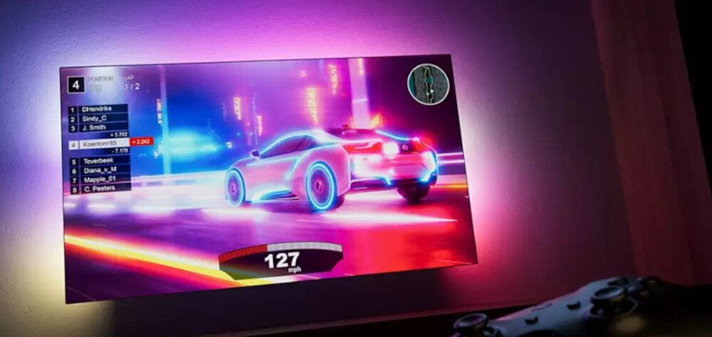 Telewizor PHILIPS 50PUS8319 gaming HDMI VRR niski input lag Ambilight, telewizor zawieszony na ścianie, kontroler w tle