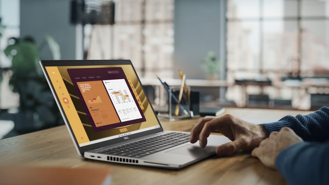 Mężczyzna korzysta z laptopa DELL Latitude 5550, na ekranie widoczny wykres. - bezpieczeństwo DELL Safe ID i DELL SafeBIOS