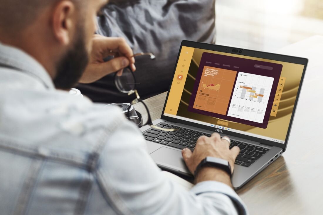 Mężczyzna korzysta z laptopa DELL Latitude 5440, na ekranie widoczny wykres. - bezpieczeństwo DELL Safe ID i DELL SafeBIOS  