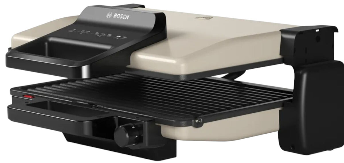 Grill elektryczny BOSCH TCG3302, regulacja wysokości, bezpieczny uchwyt, antypoślizgowość, wygoda, Grill BOSCH TCG3302 otwarty, widoczne ryflowane ceramiczne płyty, czarno-srebrna obudowa, zbliżenie produktu