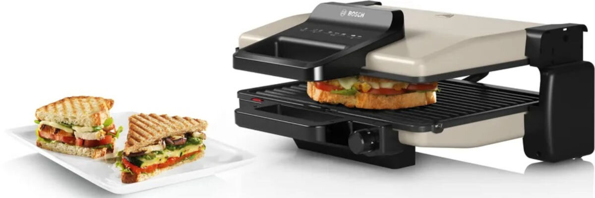 Grill elektryczny BOSCH TCG3302, grill rodzinny, wspólne gotowanie, rozkładany grill, różnorodność potraw, Grillowanie kanapki w BOSCH TCG3302, na boku talerz z panini, soczyste warzywa, grill lekko otwarty
