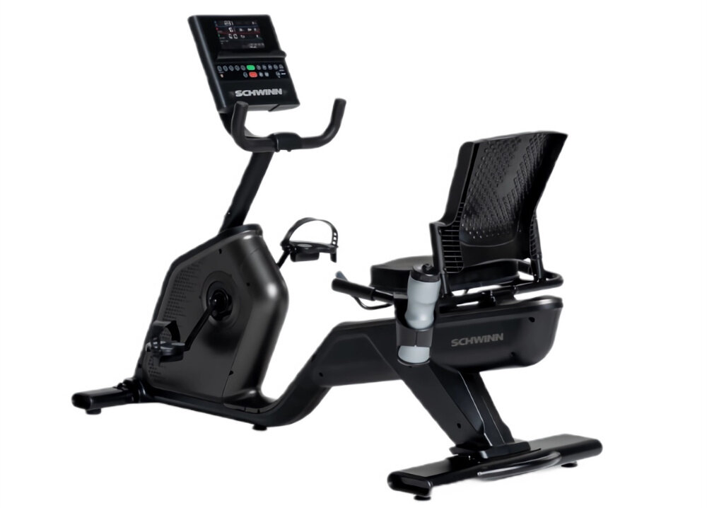 Rower magnetyczny SCHWINN R590 Urządzenie na białym tle widoczne od tyłu pod skosem solidna konstrukcja o wadze 50 kg maksymalne obciążenie do 150 kg do intensywnego użytku domowego dla osób początkujących i zaawansowanych wbudowane rolki transportowe niewielkie wymiary 119,4 x 168,7 x 71,1 cm