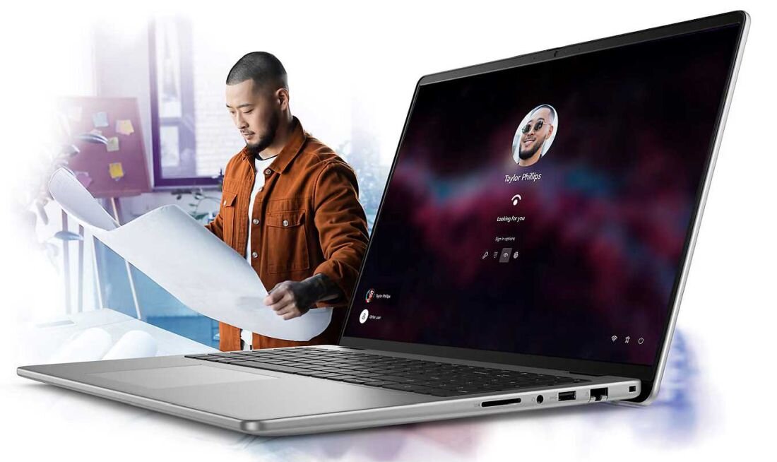 Laptop Dell Vostro 16 z ekranem logowania Windows, osoba w pomarańczowej kurtce z dużą kartką papieru w tle, biurowe otoczenie. - Bateria 4-ogniowa o pojemności 54 Wh