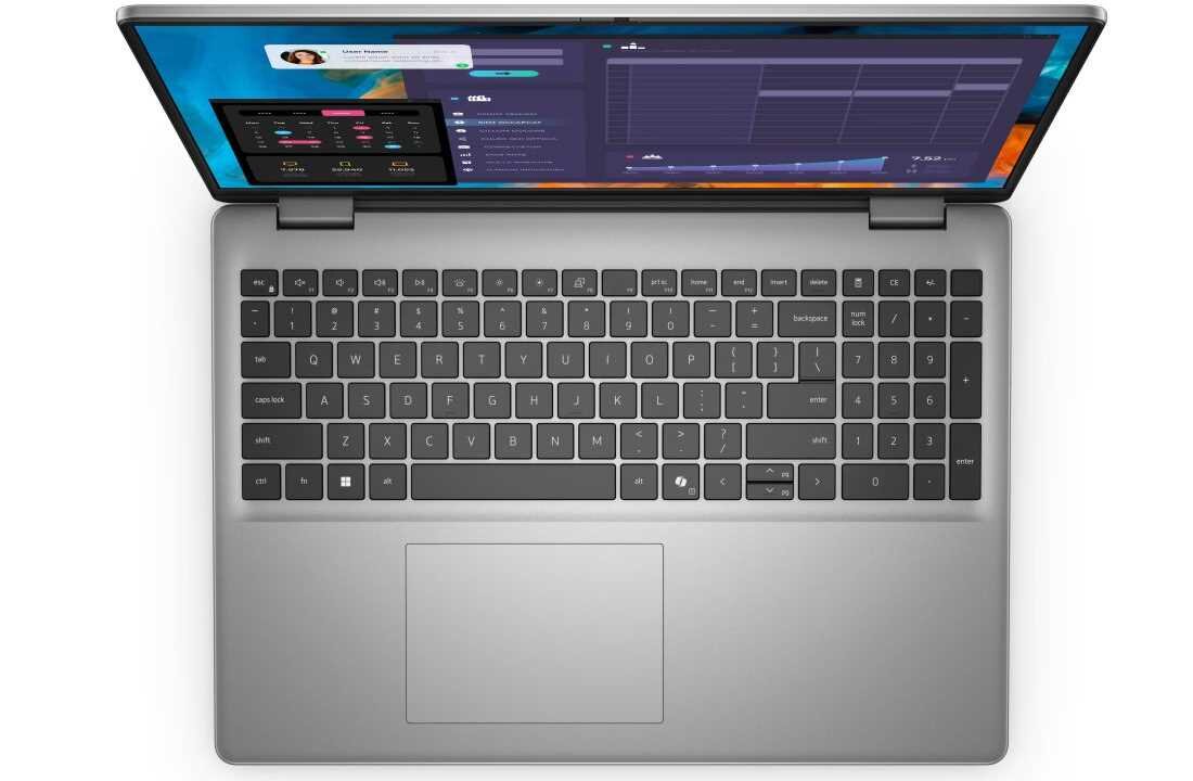 Widok z góry na klawiaturę laptopa Dell Vostro 16 z podświetleniem, szeroki touchpad, klawiatura numeryczna po prawej stronie, obudowa w kolorze srebrnym. - bezpieczne logowanie Podświetlana klawiatura