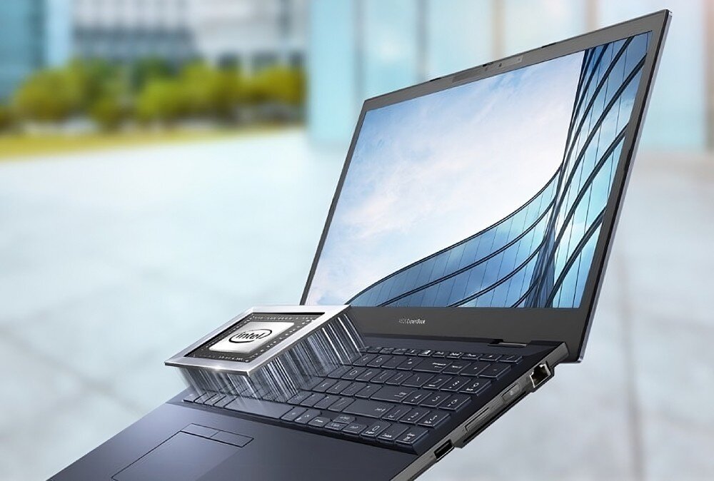 Laptop ASUS ExpertBook B2502CVA-KJ0388X Laptop z wizualizacją dużego procesora nad klawiaturą. W tle rozmyte otoczenie biurowe, procesor, podzespoły, rdzenie, wydajność