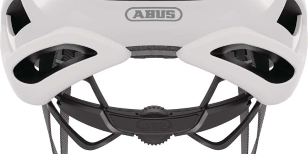 Kask rowerowy ABUS AirBreaker Polar Biały mat Szosowy rozmiar L zbliżenie na pokrętło do regulacji białe tło system Zoom Ace z precyzyjnym pokrętłem łatwe i szybkie dopasowanie kasku do obwodu głowy w zakresie od 59 do 61 cm regulacja jedną ręką kask nie przesuwa się w trakcie jazdy i nie powoduje ucisku bezpieczeństwo komfort