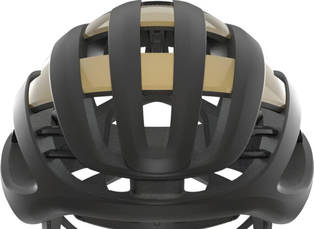 Kask rowerowy ABUS AirBreaker Czarno-złoty Szosowy rozmiar L zbliżenie na skorupę kasku zintegrowane w strukturze EPS wzmocnienie ActiCage Lite usztywnia konstrukcję w strategicznych miejscach bez ograniczania wentylacji wysoka odporność na odkształcenia w razie upadku wysoki poziom ochrony przy zachowaniu lekkości i komfortu