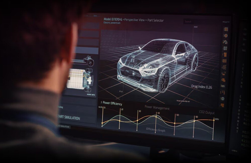 Procesor AMD Ryzen 7 9800X3D Mężczyzna siedzący przed monitorem wyświetlającym model 3D samochodu w środowisku symulacyjnym, z wykresami dotyczącymi wydajności energetycznej i emisji CO2, technologia, pamięć podręczna