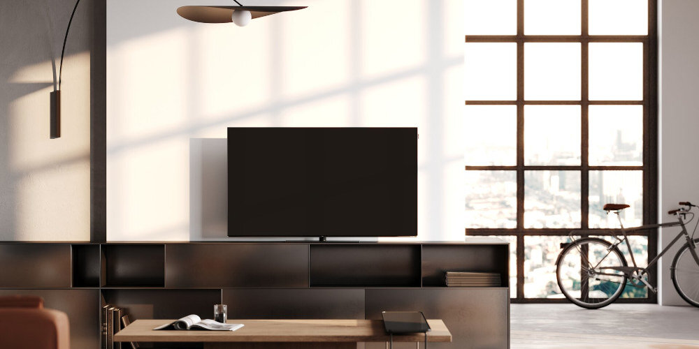 Telewizor LOEWE We See 65 - Bezpośredni Dostęp do aplikacji, telewizor stojący na szafce rtv w salonie